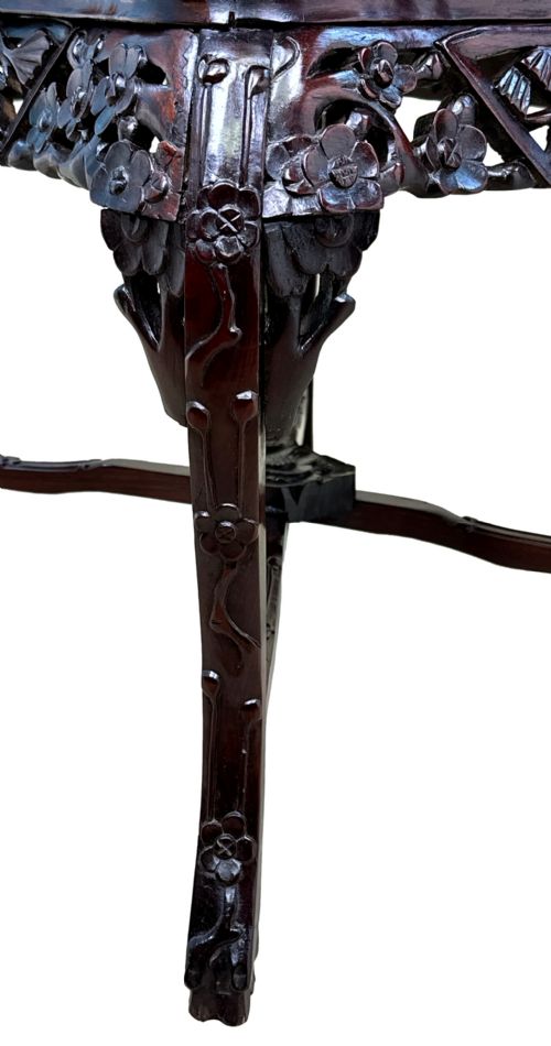 fig 1. A 19th-century rectangular dark hardwood low table with an inset marble panel top, deeply carved floral apron, and cabriole legs.