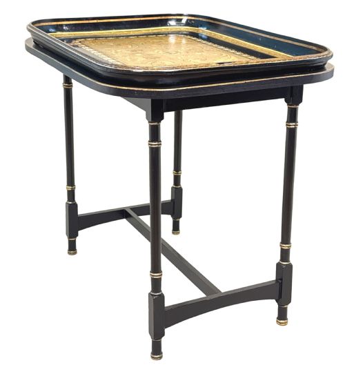 fig 1. A 19th-century black papier-mache tray featuring gilded rim decoration, resting on a black turned wooden stand with gold accent rings.