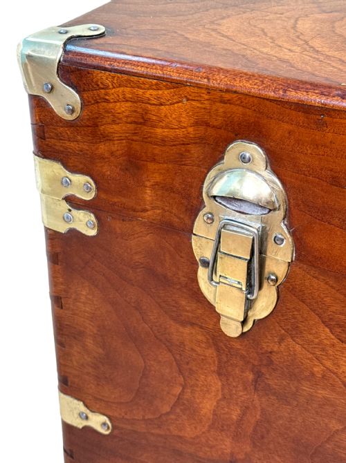 fig 1. A large nineteenth-century camphor wood campaign trunk featuring brass corner mounts, heavy latches, and exposed dovetail joints.
