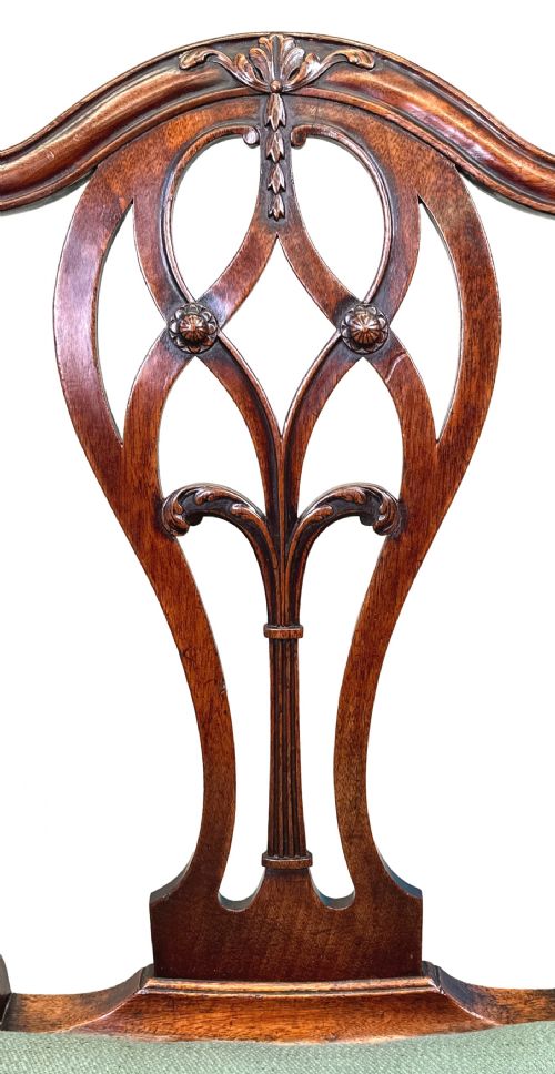 fig 1. A pair of 18th-century Georgian mahogany side chairs featuring pierced back splats, serpentine top rails, and light green upholstered drop-in seats.