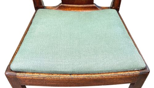 fig 2. A pair of 18th-century Georgian mahogany side chairs featuring pierced back splats, serpentine top rails, and light green upholstered drop-in seats.