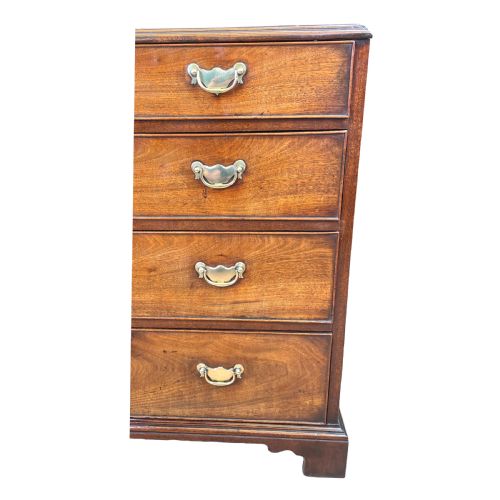 fig 1. An 18th-century Georgian mahogany chest of drawers featuring four graduated drawers with brass swan-neck handles, escutcheons, and bracket feet.
