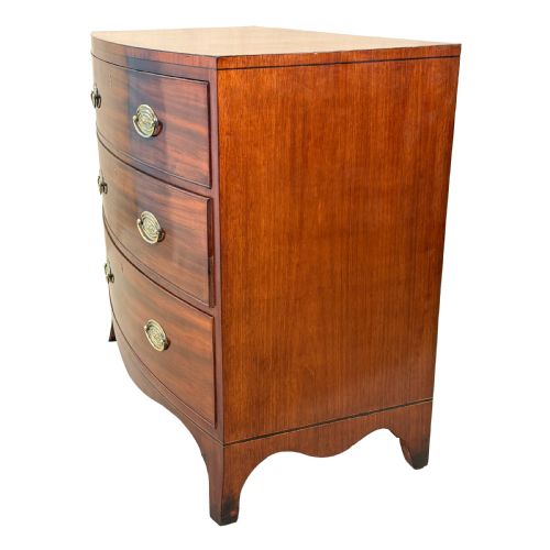 fig 1. An 18th century George III mahogany bowfront chest of drawers with three graduated drawers and splayed bracket feet.
