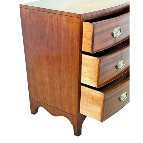 fig 2. An 18th century George III mahogany bowfront chest of drawers with three graduated drawers and splayed bracket feet.