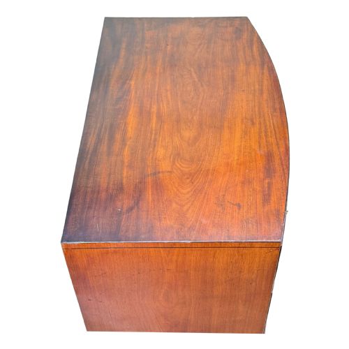 fig 3. An 18th century George III mahogany bowfront chest of drawers with three graduated drawers and splayed bracket feet.