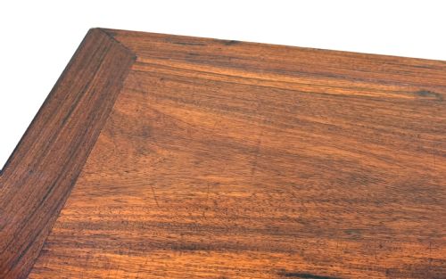 fig 2. A 19th-century Chinese hardwood coffee table with a rectangular inset top, openwork carved bamboo apron, and low legs.