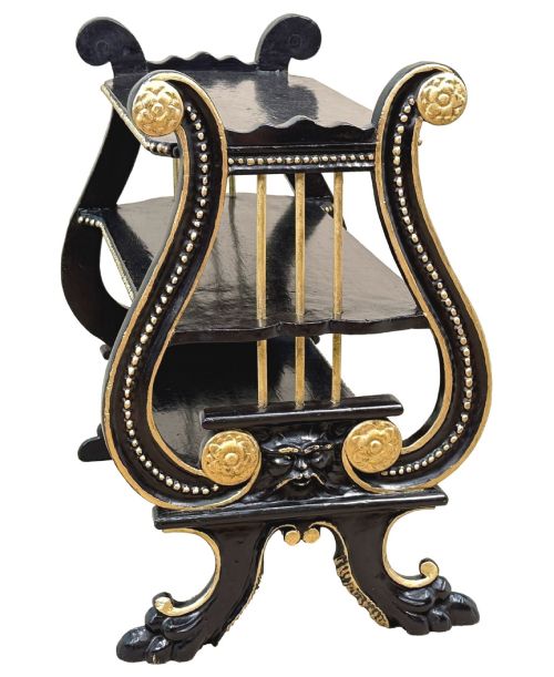 fig 1. A late nineteenth-century ebonised three-tiered etagere featuring lyre-shaped side supports, gilt bead trim along the shelf edges, and carved scroll feet.