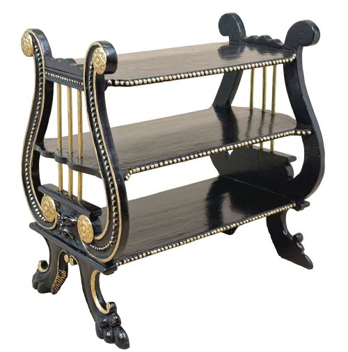 fig 3. A late nineteenth-century ebonised three-tiered etagere featuring lyre-shaped side supports, gilt bead trim along the shelf edges, and carved scroll feet.