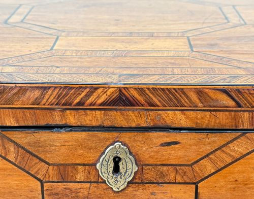 fig 4. An 18th-century George II satinwood and kingwood parquetry box cellarette with brass carrying handles on square legs.