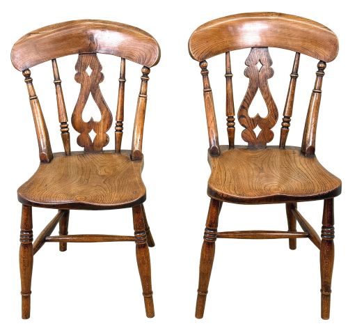 fig 1. A set of six Victorian wooden Windsor dining chairs featuring shaped crest rails, pierced back splats, contoured saddle seats, and turned legs.
