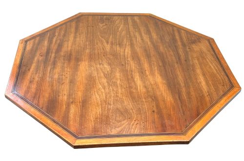 fig 4. An 18th-century Georgian mahogany octagonal centre table with inlaid crossbanding, a central pedestal column, and tripod legs on brass castors.