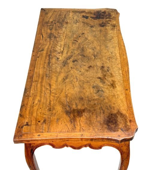 fig 2. A late 18th-century French Provincial cherry wood side table featuring cabriole legs, a scalloped apron, and a single drawer with a brass escutcheon.