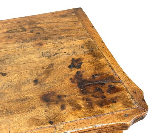 fig 3. A late 18th-century French Provincial cherry wood side table featuring cabriole legs, a scalloped apron, and a single drawer with a brass escutcheon.