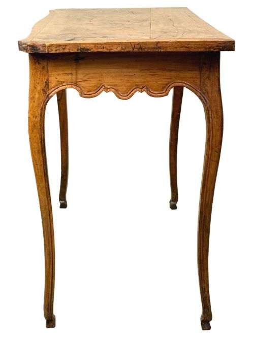 fig 5. A late 18th-century French Provincial cherry wood side table featuring cabriole legs, a scalloped apron, and a single drawer with a brass escutcheon.