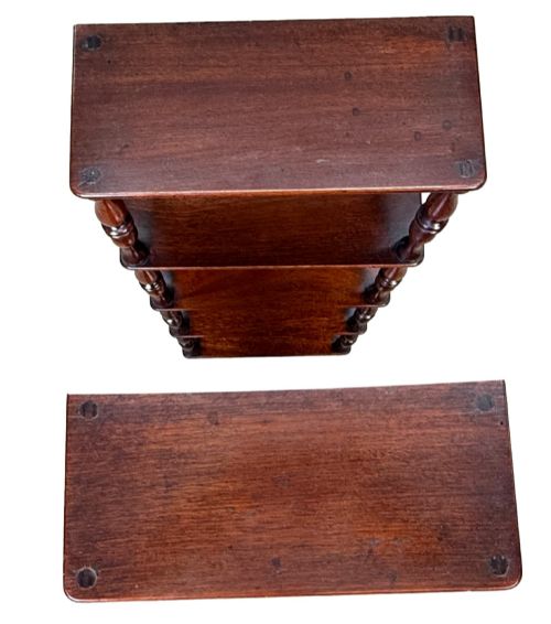fig 6. A pair of tall mid-19th-century mahogany wall-hanging shelves featuring five open tiers supported by turned spindles.