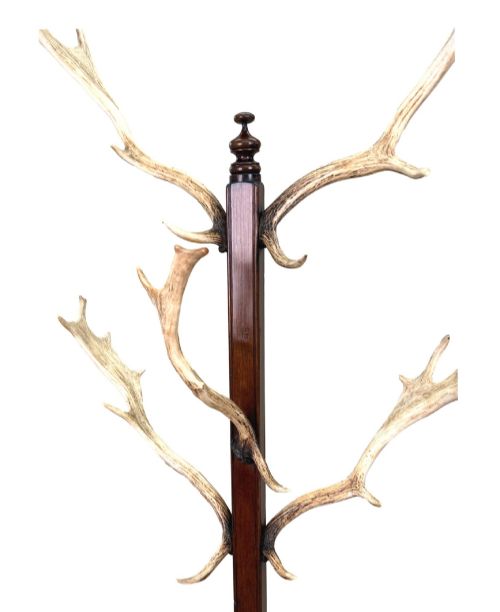 fig 1. A 19th-century dark walnut hall stand featuring a central turned column mounted with stag antler hooks and a circular dish base.