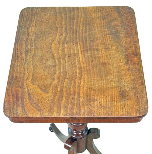 fig 2. A Regency period mahogany wine table with a rectangular top, a turned central pedestal column, and three splayed legs ending in ball feet.