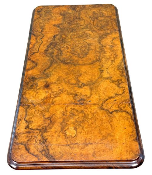 fig 2. A 19th-century burr walnut Pembroke side table with a single drawer, two drop-down side leaves, turned fluted legs, and brass castors.