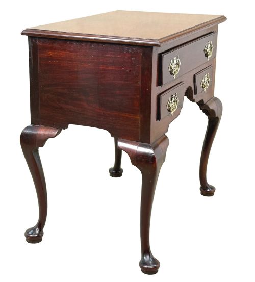 fig 1. An early Georgian mahogany lowboy table featuring three drawers with brass handles, a shaped apron, and four cabriole legs.