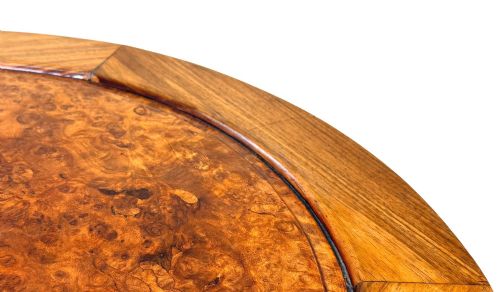 fig 1. A circular 19th-century Chinese export hardwood coffee table featuring an inset burr wood top, carved scroll aprons, and curved legs.