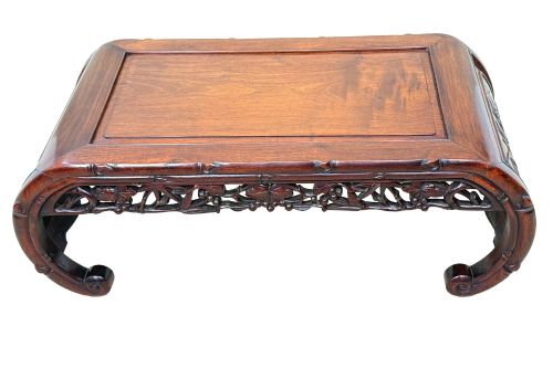fig 3. A 19th-century dark hardwood Chinese export opium coffee table featuring scrolled legs and intricately carved pierced floral aprons.