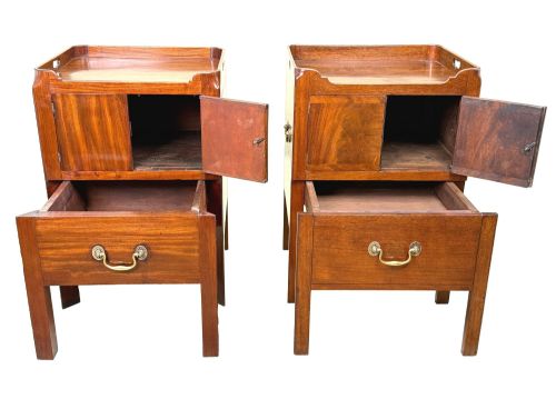 fig 4. A matched pair of Georgian mahogany bedside tables featuring top tray galleries with cutout handles, double cupboard doors, lower drawers, and brass hardware.
