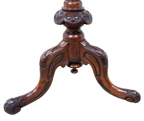 fig 3. A Victorian burr walnut oval occasional table with marquetry inlay top, a turned central pedestal, and carved tripod cabriole feet.