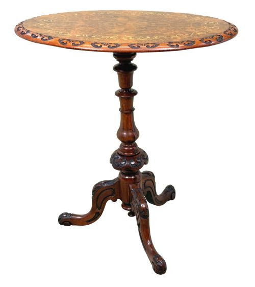 fig 4. A Victorian burr walnut oval occasional table with marquetry inlay top, a turned central pedestal, and carved tripod cabriole feet.