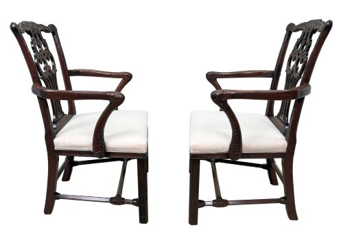 fig 1. A pair of 18th-century Chippendale mahogany carver armchairs featuring intricately carved pierced back splats, curved arms, and neutral upholstered drop-in seats.