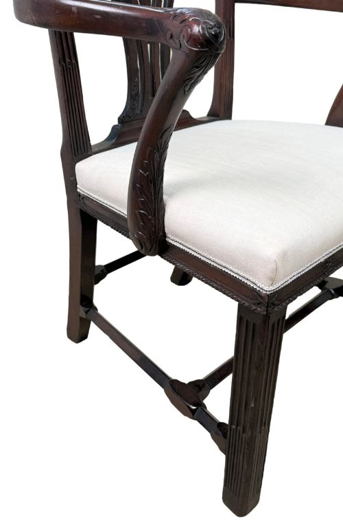 fig 2. A pair of 18th-century Chippendale mahogany carver armchairs featuring intricately carved pierced back splats, curved arms, and neutral upholstered drop-in seats.