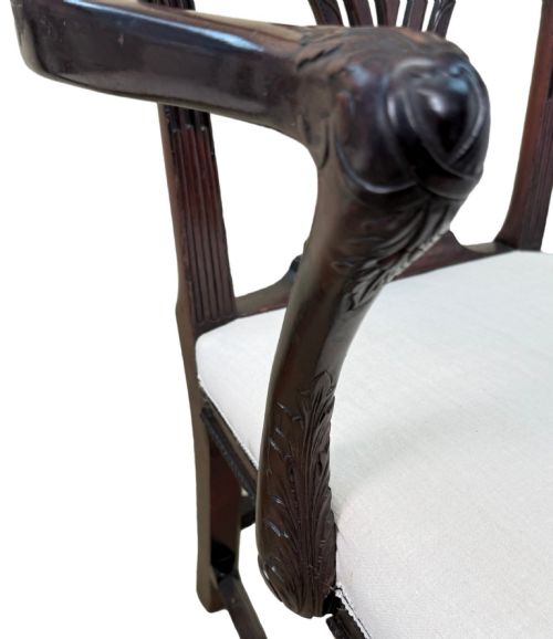 fig 5. A pair of 18th-century Chippendale mahogany carver armchairs featuring intricately carved pierced back splats, curved arms, and neutral upholstered drop-in seats.