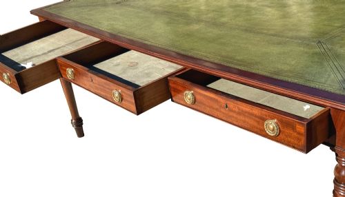 fig 2. A large 19th-century Georgian mahogany partners writing table with frieze drawers, brass handles, turned legs, and a dark leather writing surface.