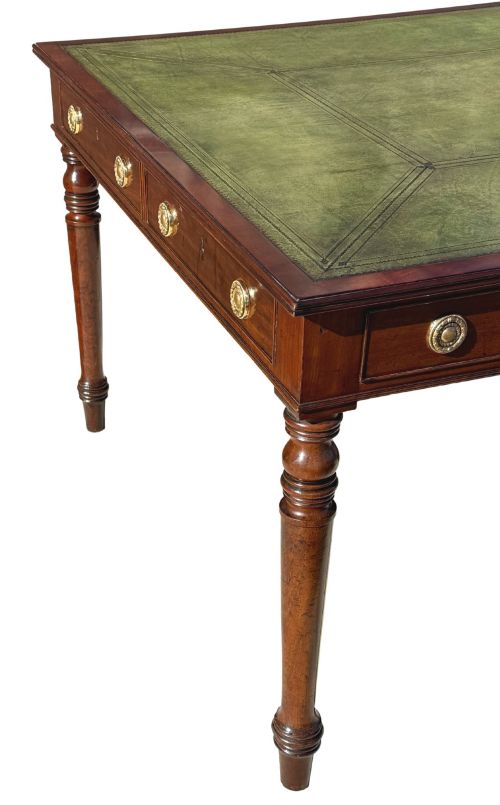 fig 3. A large 19th-century Georgian mahogany partners writing table with frieze drawers, brass handles, turned legs, and a dark leather writing surface.