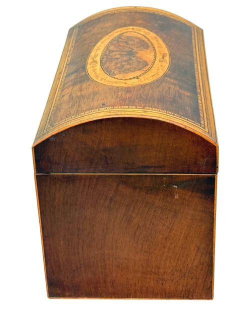 fig 3. A late 18th-century George III wooden tea caddy featuring a domed lid, intricate marquetry inlay with central oval medallions, and geometric border stringing.