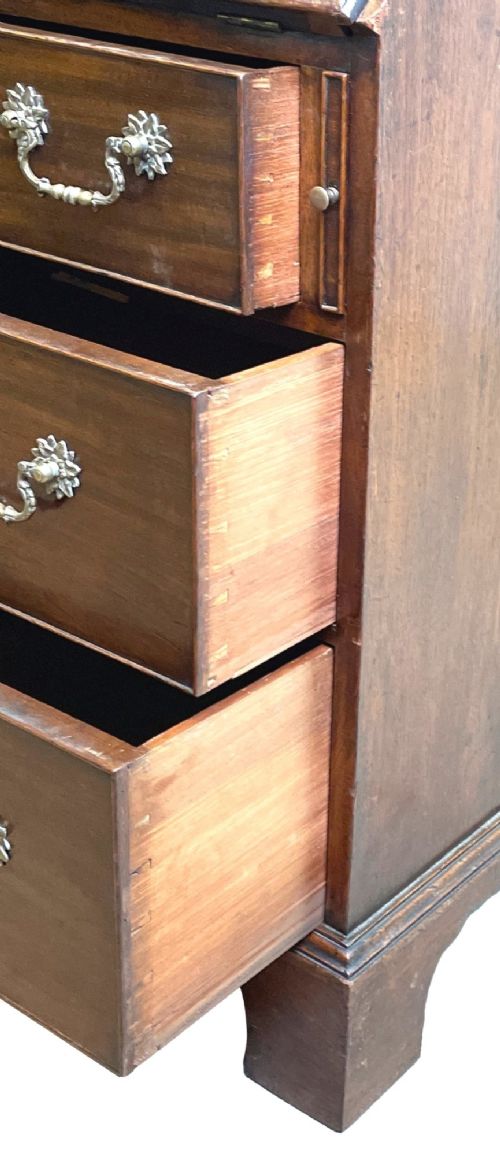 A Georgian mahogany bureau bookcase featuring an upper mirrored cabinet door above a slant-front desk and three lower drawers. View VII