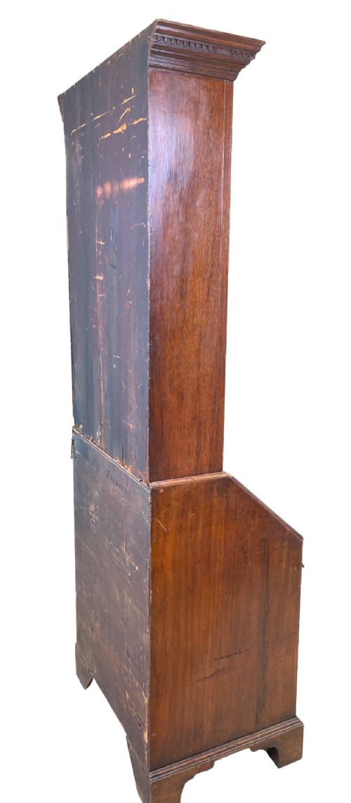 A Georgian mahogany bureau bookcase featuring an upper mirrored cabinet door above a slant-front desk and three lower drawers. View X
