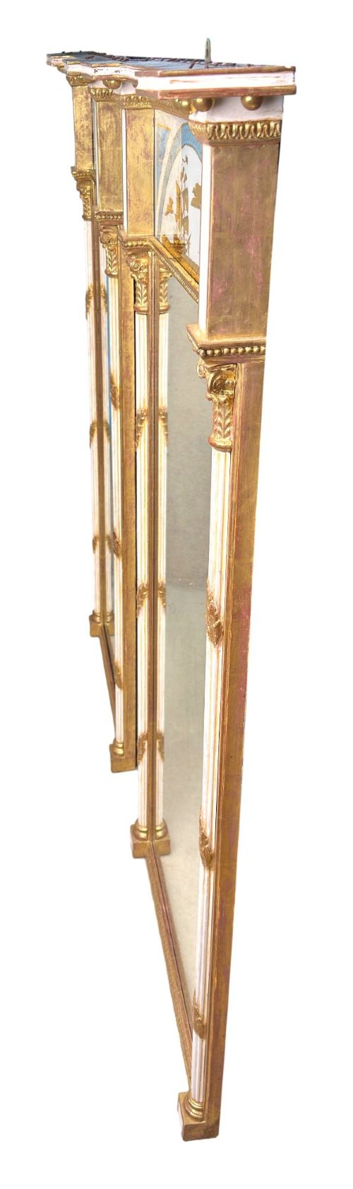 A pair of tall early 19th-century Regency pier mirrors featuring gilded pilasters, breakfront cornices, and upper painted panels depicting maritime sailing vessels. View VIII