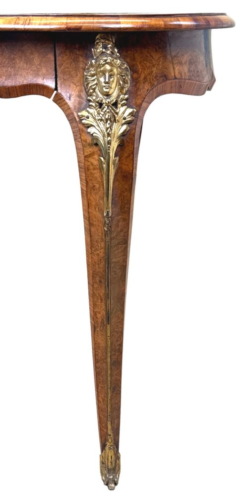 A 19th-century burr walnut kidney-shaped writing table featuring an inset leather top, gilt bronze espagnolette mounts, and cabriole legs. View VIII