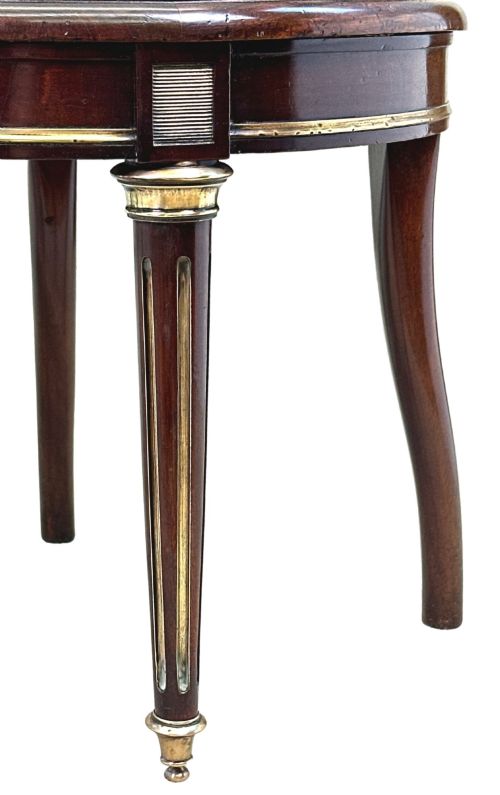 fig 2. A pair of 19th-century French mahogany curved-back salon chairs with brass mounts, spindle details, woven cane seats, and turned front legs.