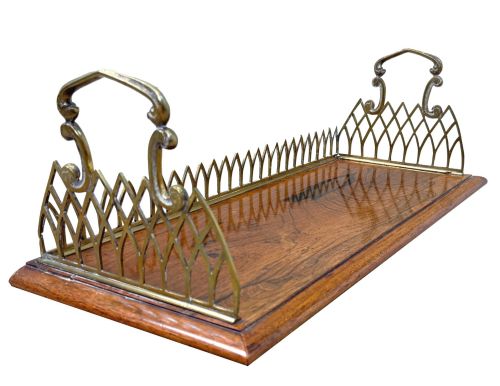 fig 2. A rectangular rosewood desk tray with a polished grain surface, featuring decorative pointed brass gallery borders and arched carrying handles at each end.