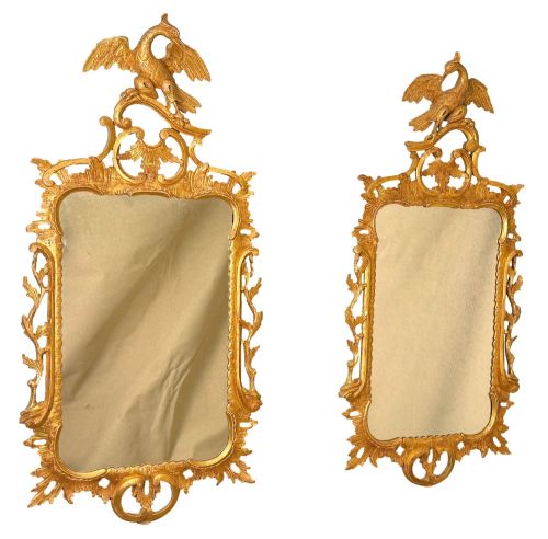 fig 1. A pair of 18th-century Chippendale style giltwood wall mirrors featuring carved Rococo scroll frames topped with bird crests.