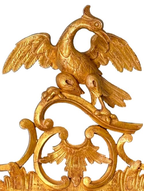 fig 2. A pair of 18th-century Chippendale style giltwood wall mirrors featuring carved Rococo scroll frames topped with bird crests.