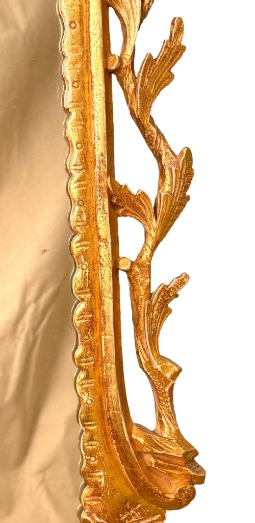 fig 4. A pair of 18th-century Chippendale style giltwood wall mirrors featuring carved Rococo scroll frames topped with bird crests.