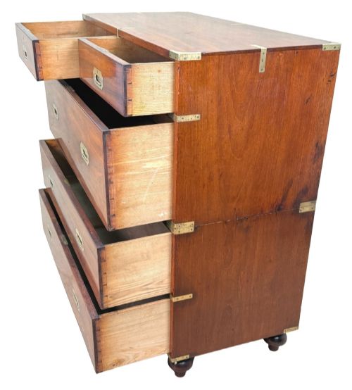 fig 2. A mid-19th century camphor wood military campaign chest of drawers featuring brass corner brackets, flush handles, and two separate stacking sections on turned feet.