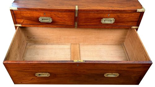 fig 3. A mid-19th century camphor wood military campaign chest of drawers featuring brass corner brackets, flush handles, and two separate stacking sections on turned feet.