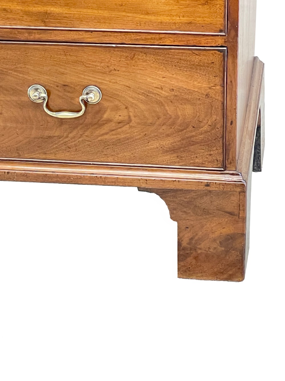 An 18th-century Georgian mahogany chest on chest featuring graduated drawers, carved fretwork, dentil moulding, and brass handles. View VIII