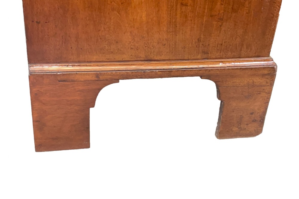 An 18th-century Georgian mahogany chest on chest featuring graduated drawers, carved fretwork, dentil moulding, and brass handles. View XI