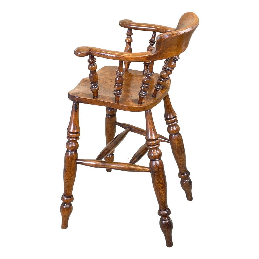 A 19th-century wooden clerk chair featuring a curved horseshoe backrest, turned spindles, a shaped saddle seat, and tall turned legs with double stretchers. View II