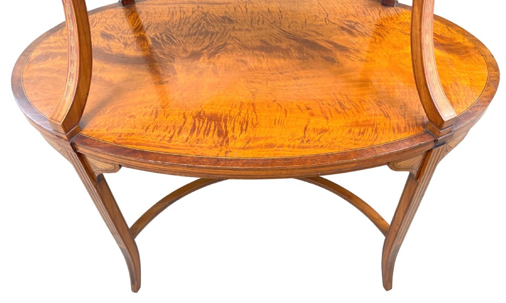 A 19th-century oval satinwood two-tier etagere table featuring geometric stringing inlay, a removable brass-handled upper tray, and outswept legs joined by an X-stretcher. View VIII