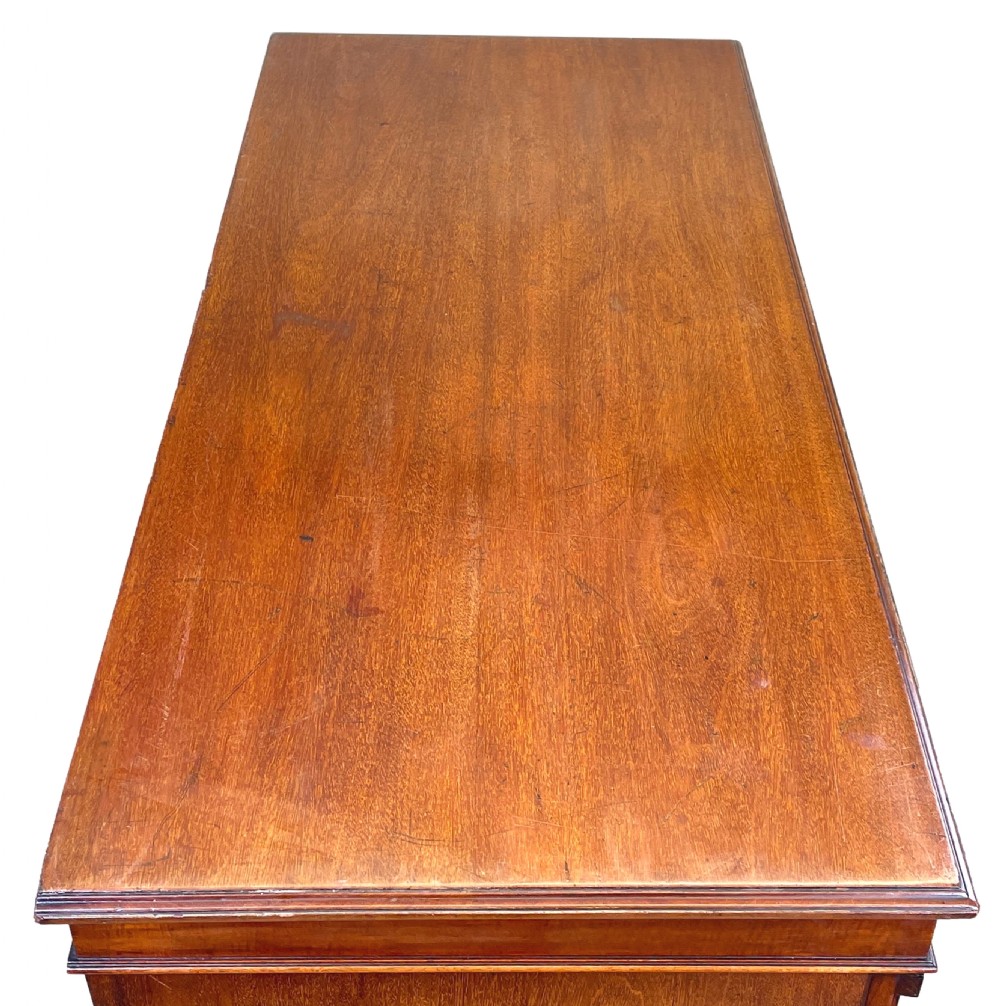 A tall Victorian mahogany double Wellington chest featuring twelve drawers arranged in two parallel columns with turned wooden knobs and side locking stiles. View II